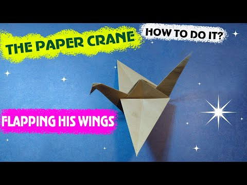 Classic origami. The crane is flapping its wings. Classic origami. The crane is flapping its wings.